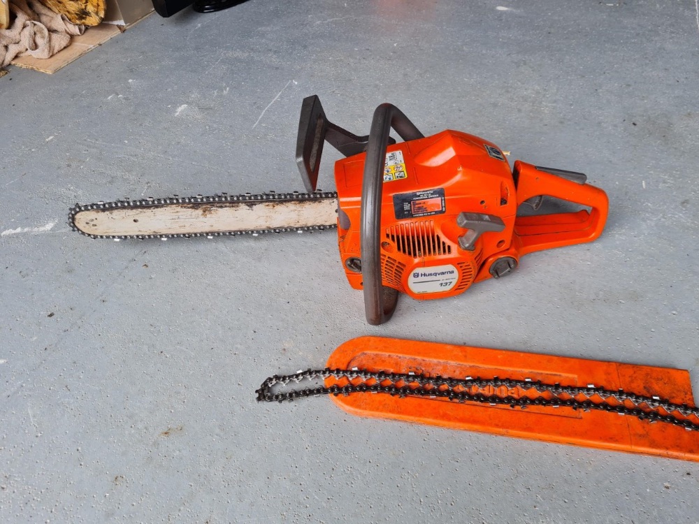 Husqvarna chainsaw plus spare blade